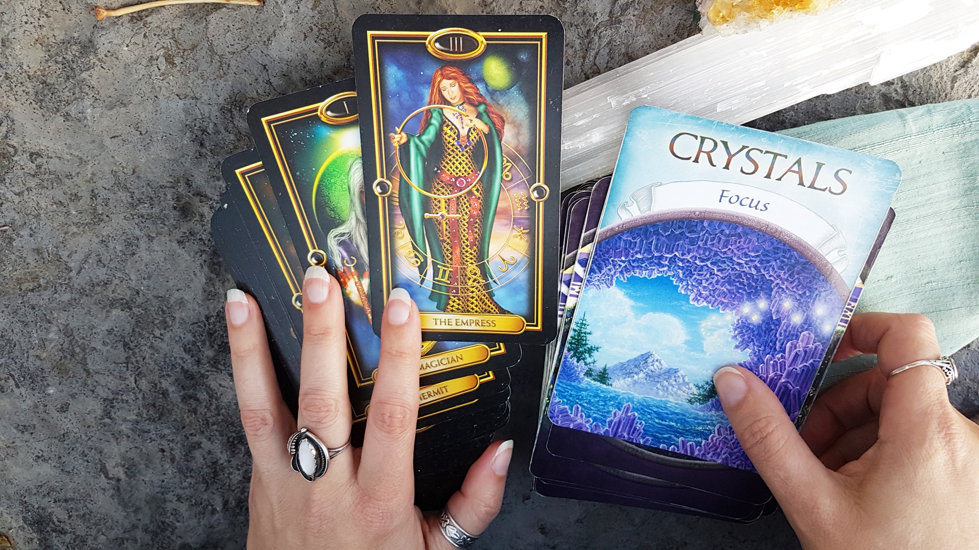 Sheila's hands with Gilded Tarot and Earth Magic Oracle Cards, photo by Sarena Miller